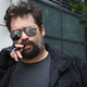 The e-cigarette-smoking man, who sources say is likely some sort of techno-mercenary sent from the 25th century to capture an escaped digi-convict.